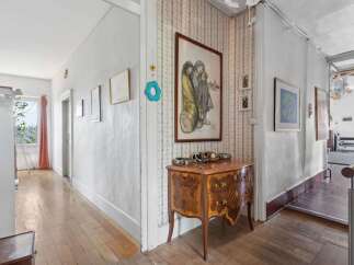 Step into this charming home and be greeted by a warm and inviting hallway.