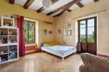 This charming bedroom features a cozy bed, perfect for relaxation.