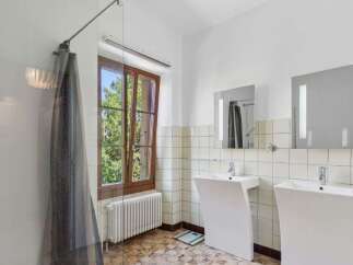 This stunning bathroom boasts a modern design with a touch of elegance.