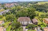 Discover this stunning property nestled in a serene, green landscape.
