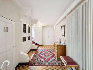 Step into this elegant entryway, showcasing a blend of classic design and modern comfort.