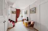 Discover the charm of this inviting property, featuring a cozy seating area perfect for relaxation.