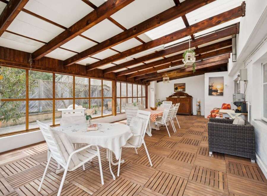 This stunning property boasts a bright and airy sunroom, perfect for enjoying the outdoors in comfort.
