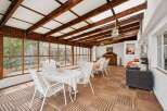 This stunning property boasts a bright and airy sunroom, perfect for enjoying the outdoors in comfort.