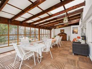 This stunning property boasts a bright and airy sunroom, perfect for enjoying the outdoors in comfort.
