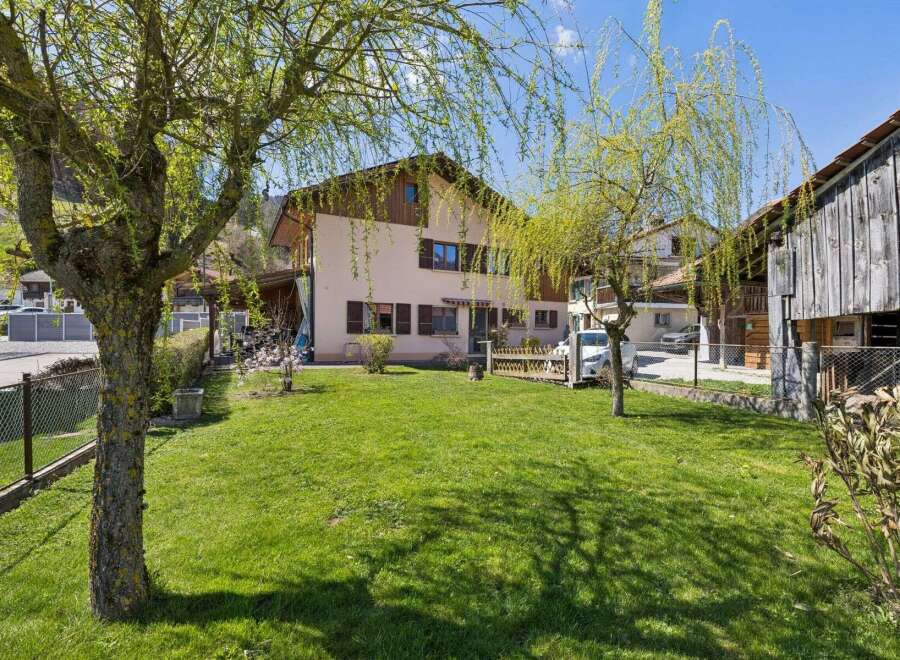 Discover this charming property featuring a well-maintained lawn and a beautiful house.