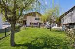 Discover this charming property featuring a well-maintained lawn and a beautiful house.