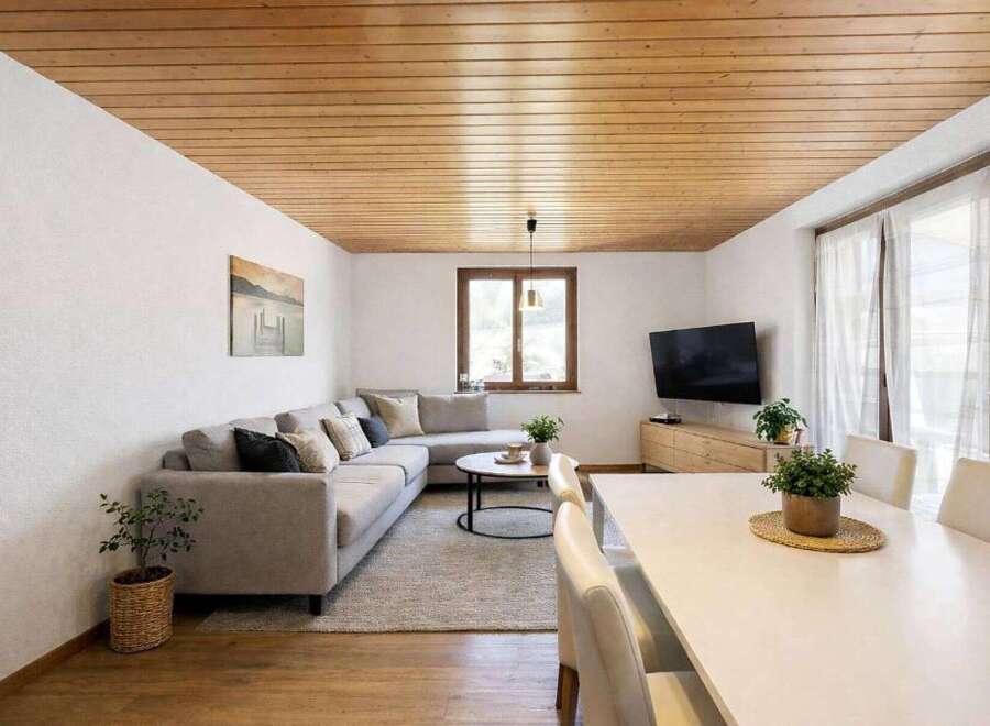 This stunning living space boasts a warm and inviting atmosphere, perfect for relaxation and entertaining.