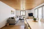 This stunning living space boasts a warm and inviting atmosphere, perfect for relaxation and entertaining.