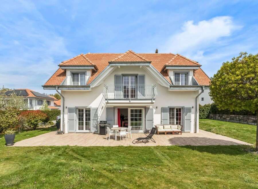 Discover your dream home! This stunning property boasts a beautiful exterior with a charming red-tiled roof and elegant shutters.