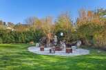 Discover the perfect outdoor oasis in this stunning property! Featuring a beautifully designed fire pit area, ideal for cozy gatherings and entertaining.