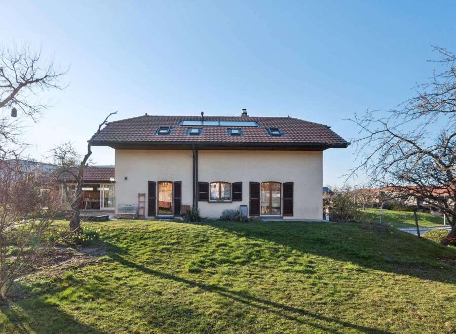 This charming property boasts a classic design with a warm, inviting facade.