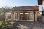 Discover this charming property featuring a cozy patio and a sunlit interior.