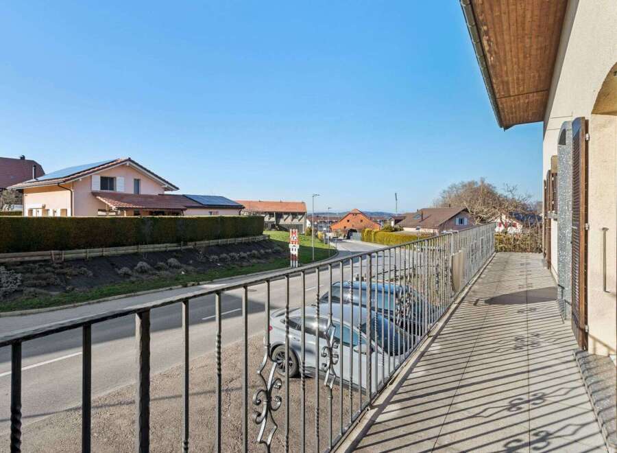 Enjoy stunning views from this charming property! This home features a beautiful balcony with intricate wrought iron detailing, perfect for relaxing and taking in the surroundings.