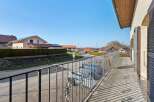 Enjoy stunning views from this charming property! This home features a beautiful balcony with intricate wrought iron detailing, perfect for relaxing and taking in the surroundings.
