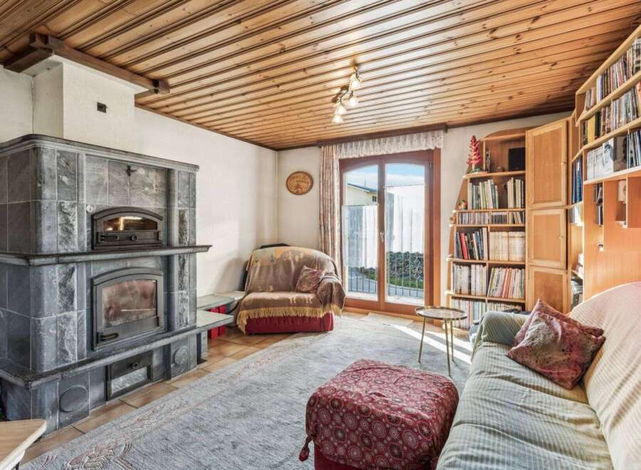 Step into this inviting living space, featuring a stunning stone fireplace that serves as a focal point.