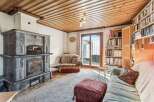 Step into this inviting living space, featuring a stunning stone fireplace that serves as a focal point.