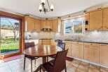 This charming kitchen features a warm and inviting atmosphere, perfect for family gatherings and culinary adventures.