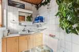 This charming bathroom features a bright and airy design, perfect for a relaxing retreat.