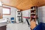 This charming property boasts a unique combination of functionality and style, featuring a dedicated laundry area with modern appliances.