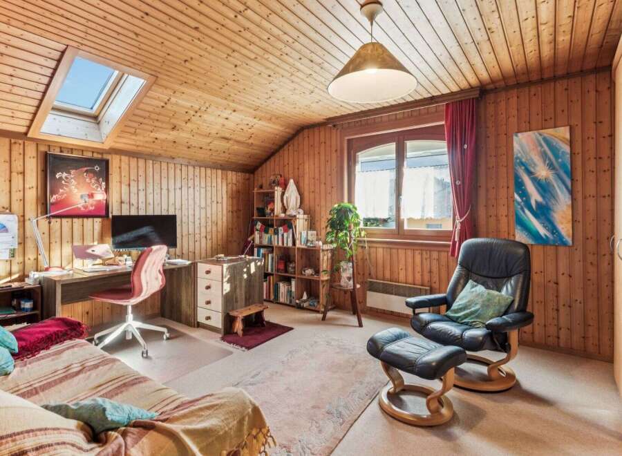 This cozy room features a warm wooden interior, creating a welcoming atmosphere.