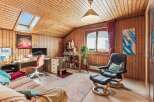 This cozy room features a warm wooden interior, creating a welcoming atmosphere.