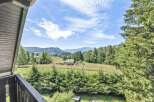 Enjoy breathtaking views from this stunning property! This home offers a serene escape with lush greenery and mountain vistas.