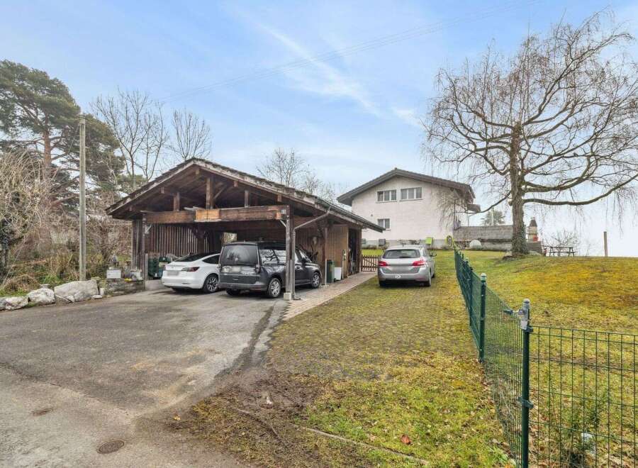 Discover this charming property featuring a covered carport, perfect for protecting your vehicles from the elements.