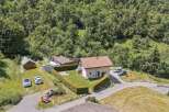 Nestled in a serene, wooded landscape, this charming property offers a tranquil retreat.