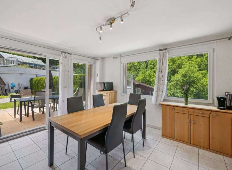 This bright and airy dining room offers a perfect blend of indoor and outdoor living.