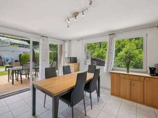This bright and airy dining room offers a perfect blend of indoor and outdoor living.