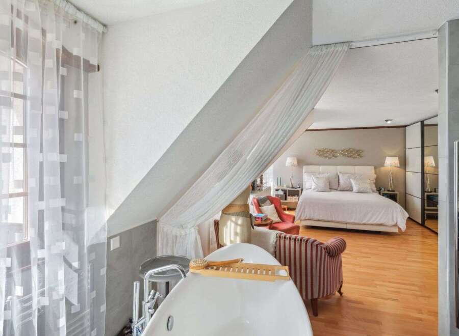 Discover the epitome of luxury living in this stunning property, featuring a master bedroom with an ensuite bathroom.
