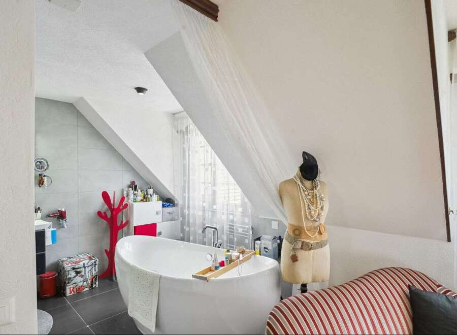 Discover the charm of this unique bathroom, featuring a stylish bathtub and a creative design.