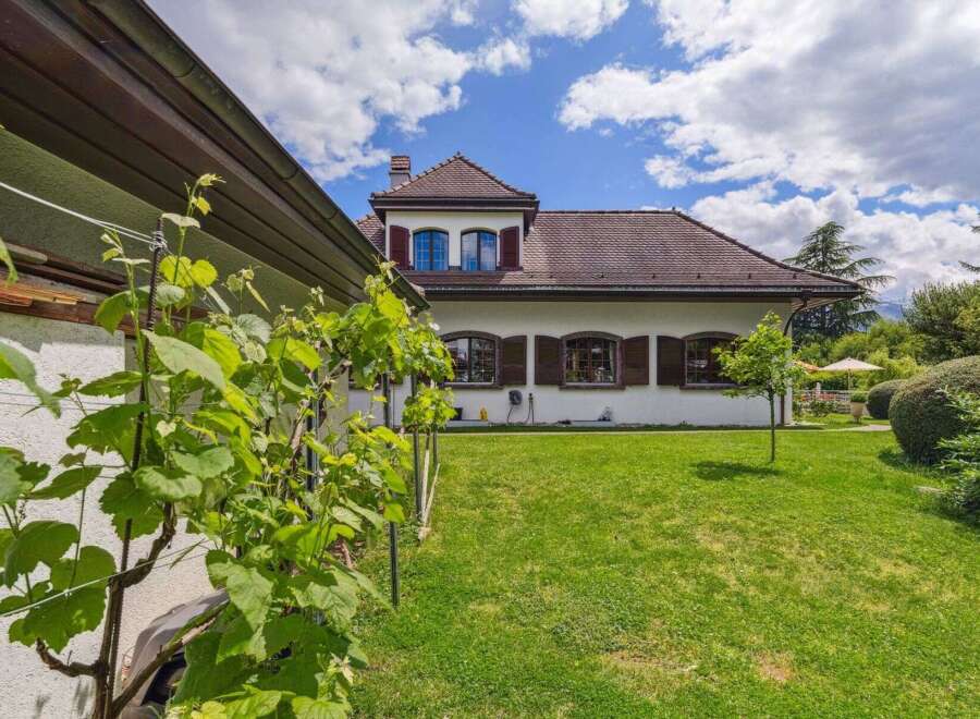 This stunning property boasts a charming facade with a classic design, offering a serene and inviting atmosphere.