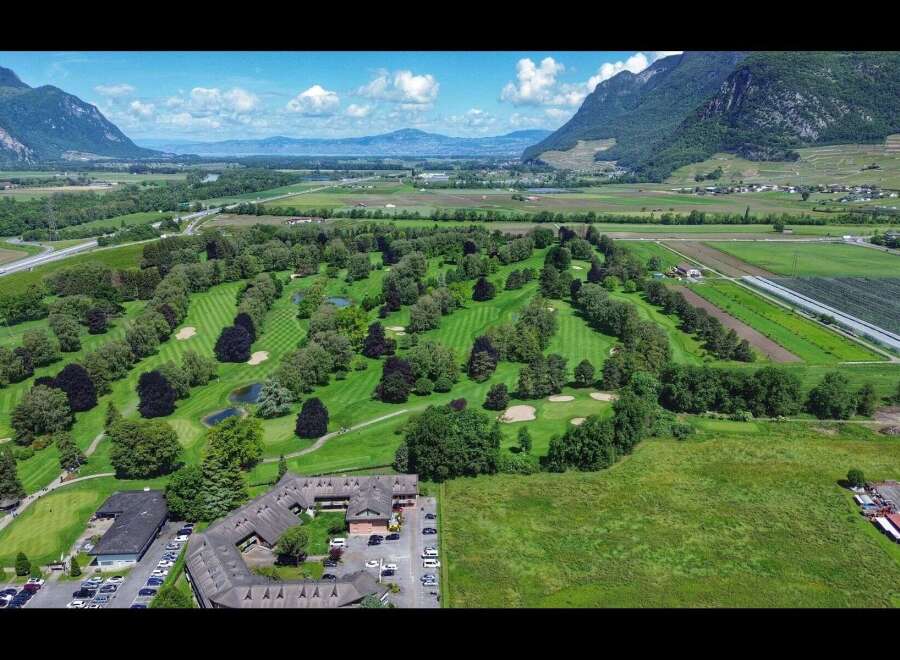 Discover a stunning golf course property nestled in a picturesque landscape.