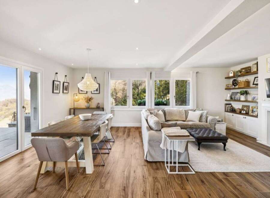 This stunning property boasts a spacious open-concept living and dining area, perfect for entertaining.