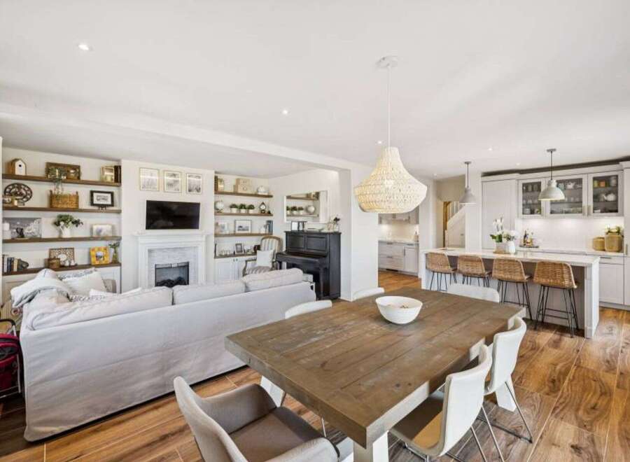 This stunning property boasts a spacious open-plan living area, perfect for modern family living and entertaining.