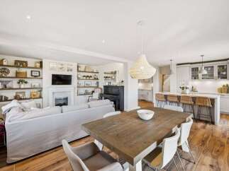 This stunning property boasts a spacious open-plan living area, perfect for modern family living and entertaining.