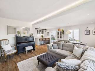 This stunning property boasts a spacious open-plan living area, perfect for entertaining.