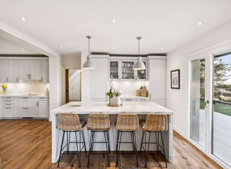 This stunning kitchen boasts a modern design with a spacious island, perfect for entertaining.