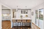 This stunning kitchen boasts a modern design with a spacious island, perfect for entertaining.