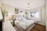 This stunning bedroom boasts a luxurious and inviting atmosphere, perfect for relaxation.