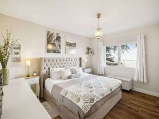 This stunning bedroom boasts a luxurious and inviting atmosphere, perfect for relaxation.
