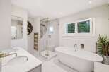 Step into luxury with this stunning bathroom featuring a sleek, modern design.
