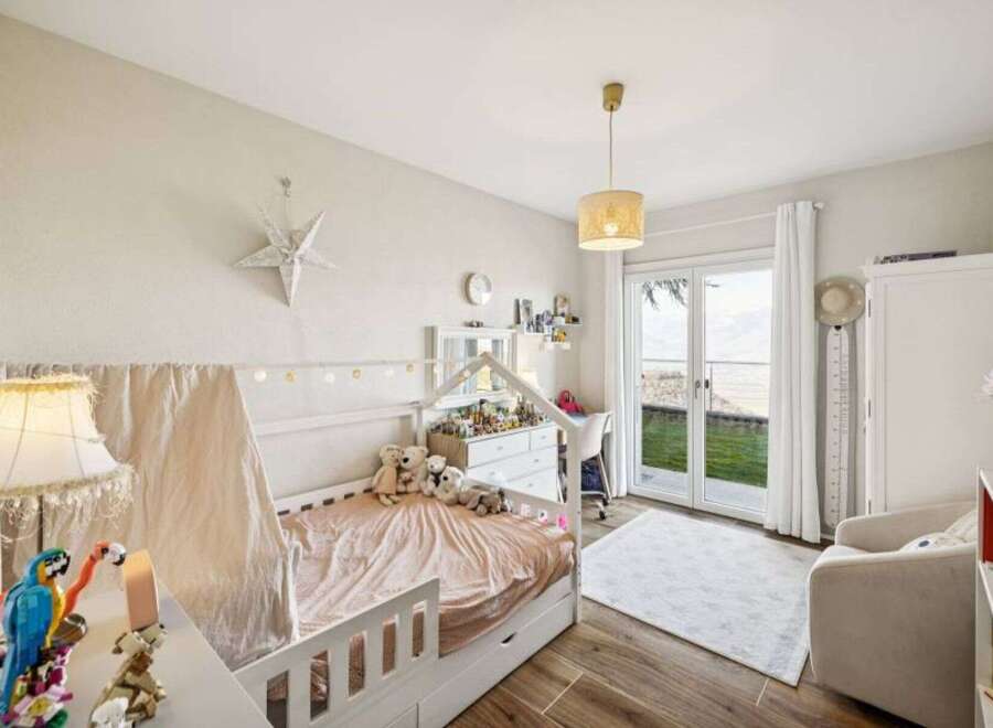 This charming bedroom offers a cozy and inviting atmosphere, perfect for a child's sanctuary.