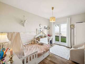 This charming bedroom offers a cozy and inviting atmosphere, perfect for a child's sanctuary.