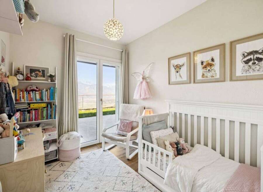 This charming nursery offers a serene and inviting space for your little one.