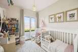 This charming nursery offers a serene and inviting space for your little one.