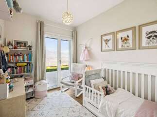 This charming nursery offers a serene and inviting space for your little one.
