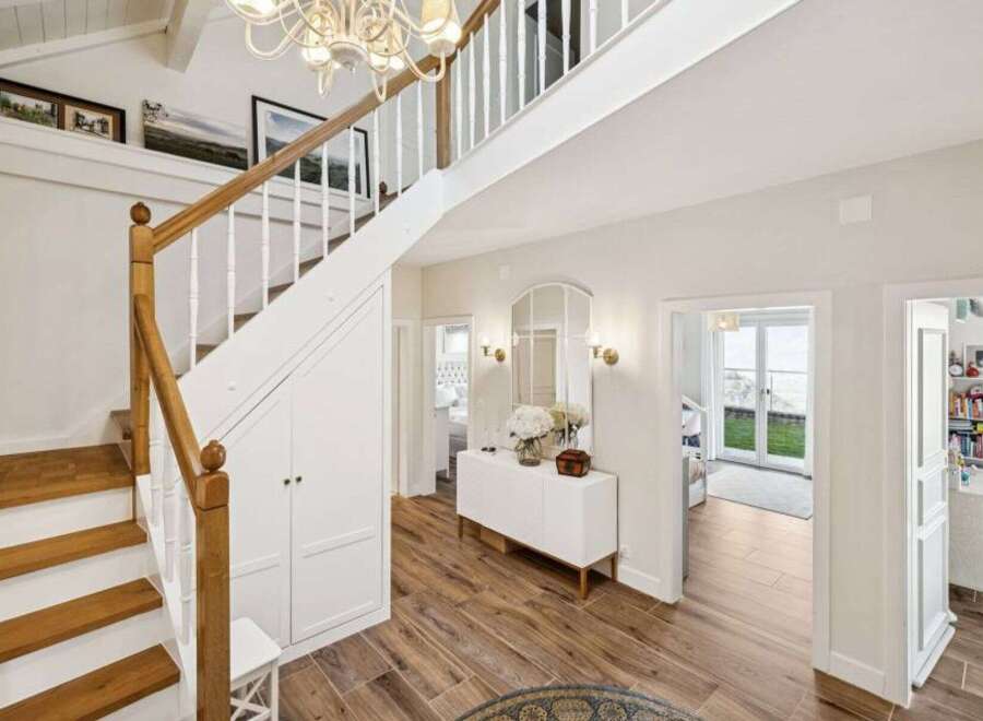 Step into luxury with this stunning property! Featuring a grand staircase, elegant hardwood floors, and a bright, airy design, this home offers both style and comfort.